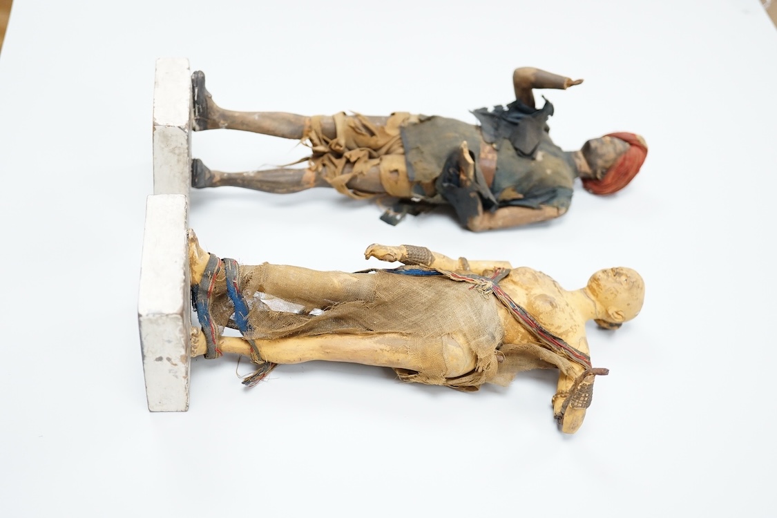 Two Indian clay figures, 26cm high